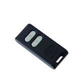 Black remote control with two buttons on a white background