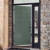 Green front door with black frame in a stone and wood exterior.