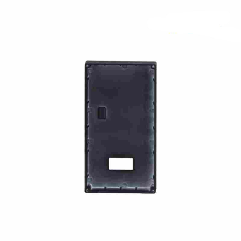 Black rectangular object with cutouts on a white background