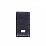 Black rectangular object with cutouts on a white background