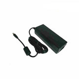 Green power adapter with cable on a white background