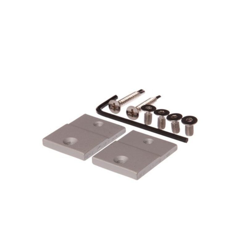 Two metal brackets with screws on a white background