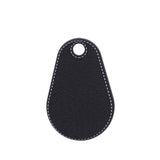 Black leather key tag with white stitching on a white background